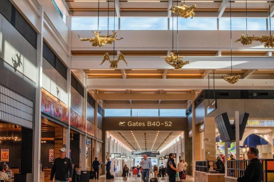 Travelers are greeted by sculptures called “Jazz Birds,” by artist Willie Cole, at Kansas City International Airport on Tuesday, Feb. 28, 2023.