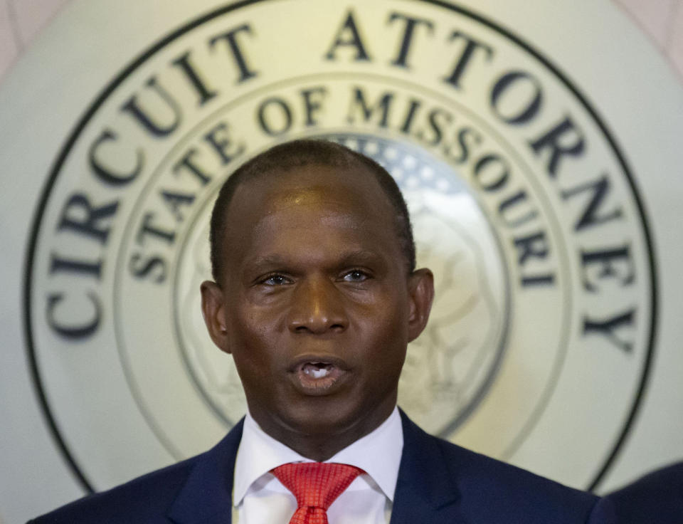 FILE - Gabe Gore steps to the podium after Gov. Mike Parson, right, announced that he would be the new St. Louis Circuit Attorney, replacing Kimberly M. Gardner, during a press conference on Friday, May 19, 2023 at the Carnahan Courthouse in St. Louis. Gore filed a motion Wednesday, Feb. 7, 2024, to vacate the first-degree murder conviction of Christopher Dunn, citing the fact that both witnesses in the cases have recanted. Less than two weeks ago, St. Louis County's prosecutor filed a similar motion to vacate the conviction of Marcellus Williams, who is on Missouri's death row for a 1998 killing. That motion cites new DNA evidence.(David Carson/St. Louis Post-Dispatch via AP, File)