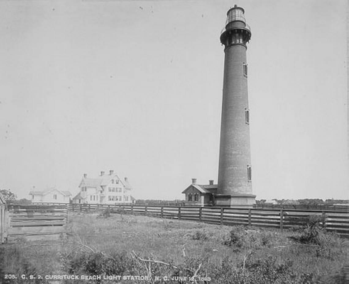 The Currituck Light Station and keepers quarters as they appeared in 1883. Outer Banks Conservationists restored the lighthouse in the 1990s and lets visitors climb the 162-foot tower from late March through the end of November.