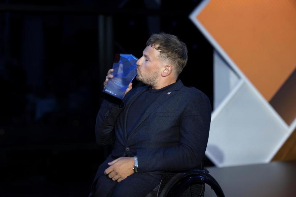 Tennis champion, Paralympian and disability advocate Dylan Alcott receives the 2022 Australian of the Year award in Canberra on Tuesday.