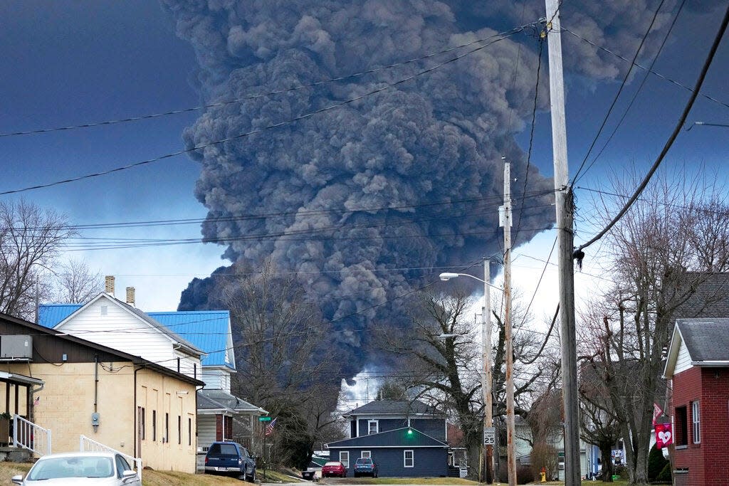 A black plume rises over East Palestine, Ohio, as a result of a controlled detonation of a portion of the derailed Norfolk Southern trains Monday, Feb. 6, 2023.