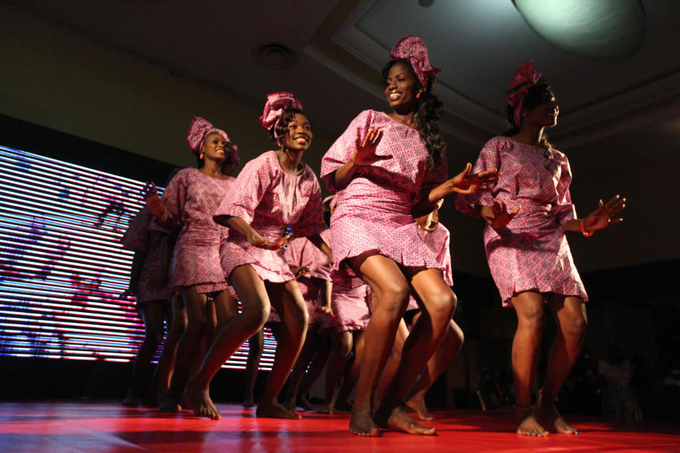 Contestants dance at the Lagos Carnival beauty pageant in Lagos, Nigeria, on Saturday, March 30, 2013. The pageant picked a queen for this year's Lagos Carnival, a festival that sees dancers fill the streets of Nigeria's largest city during Easter weekend. (AP Photo/Jon Gambrell)