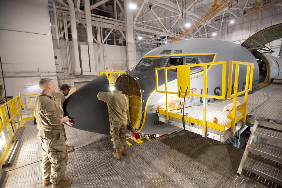 The fiberglass nose of a KC-135 air refueling aircraft is removed by crew with the 190th Air Refueling Wing of the Kansas National Guard Thursday morning. The Topeka Metropolitan Airport Authority is trying expand its offerings in the aeronautics industry.