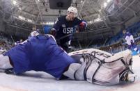 Ice Hockey - Pyeongchang 2018 Winter Olympics - Men's Playoff Match - U.S. v Slovakia - Gangneung Hockey Centre, Gangneung, South Korea - February 20, 2018 - Mark Arcobello of the U.S. reacts after scoring a goal against goalie Jan Laco of Slovakia. REUTERS/Bruce Bennett/Pool