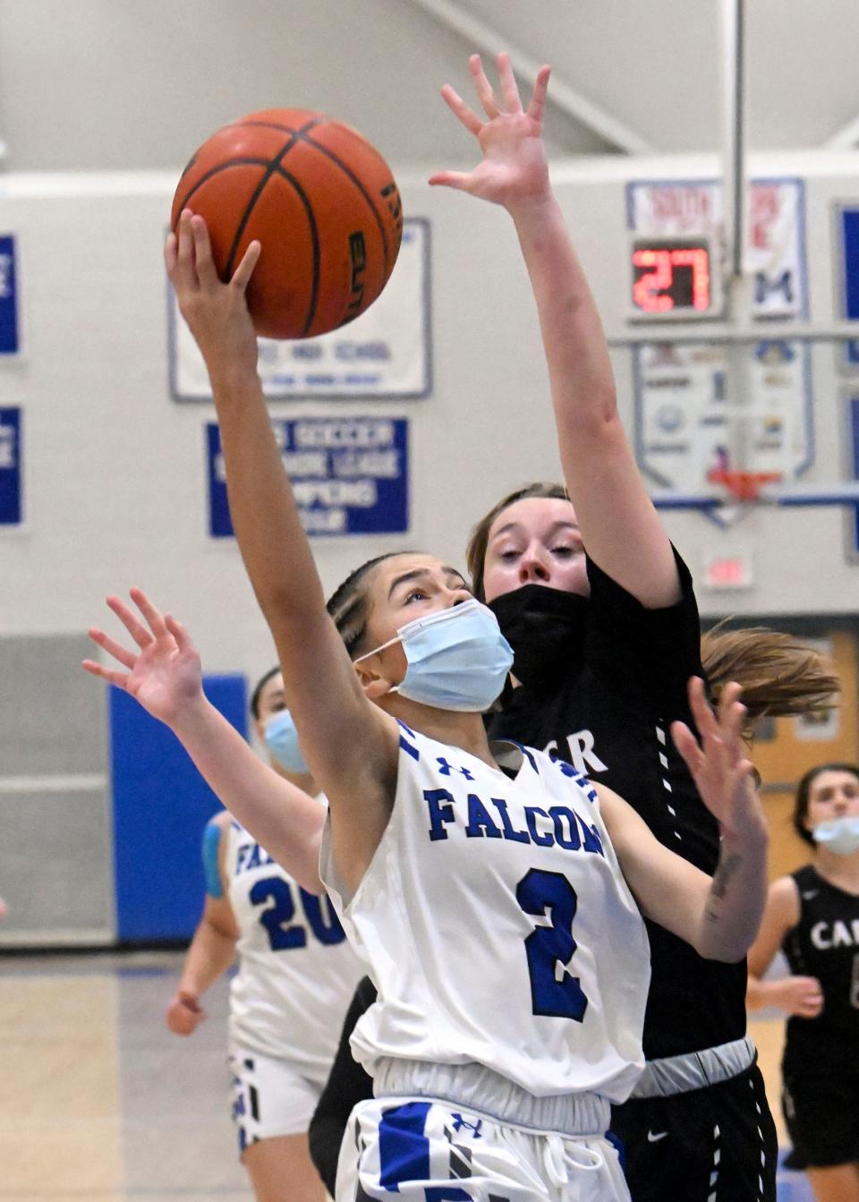 MASHPEE   02/08/22   Amiyah Peters of Mashpee goes to the hoop against Abigail Johnson of  Carver.