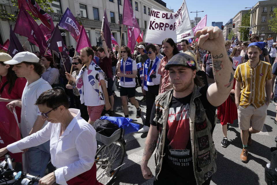 Supporters of a left-wing party march, to mark the Labor Day holiday in support of workers' rights, in Warsaw, Poland, on May 1, 2024. (AP Photo/Czarek Sokolowski)