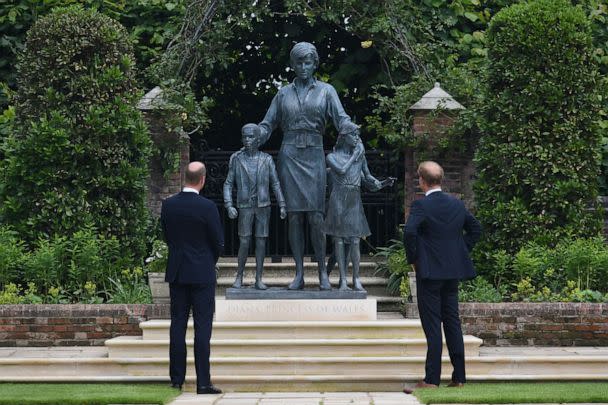 PHOTO: Prince William and Prince Harry look at a statue they commissioned of their mother Diana in the Sunken Garden at Kensington Palace, on what would have been her 60th birthday, July 1, 2021, in London. (WPA Pool/Getty Images)