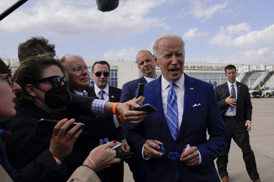 President Joe Biden speaks to reporters before boarding Air Force One at Des Moines International Airport, in Des Moines Iowa, Tuesday, April 12, 2022, en route to Washington. Biden said that Russia's war in Ukraine amounted to a "genocide," accusing President Vladimir Putin of trying to "wipe out the idea of even being a Ukrainian."(AP Photo/Carolyn Kaster)