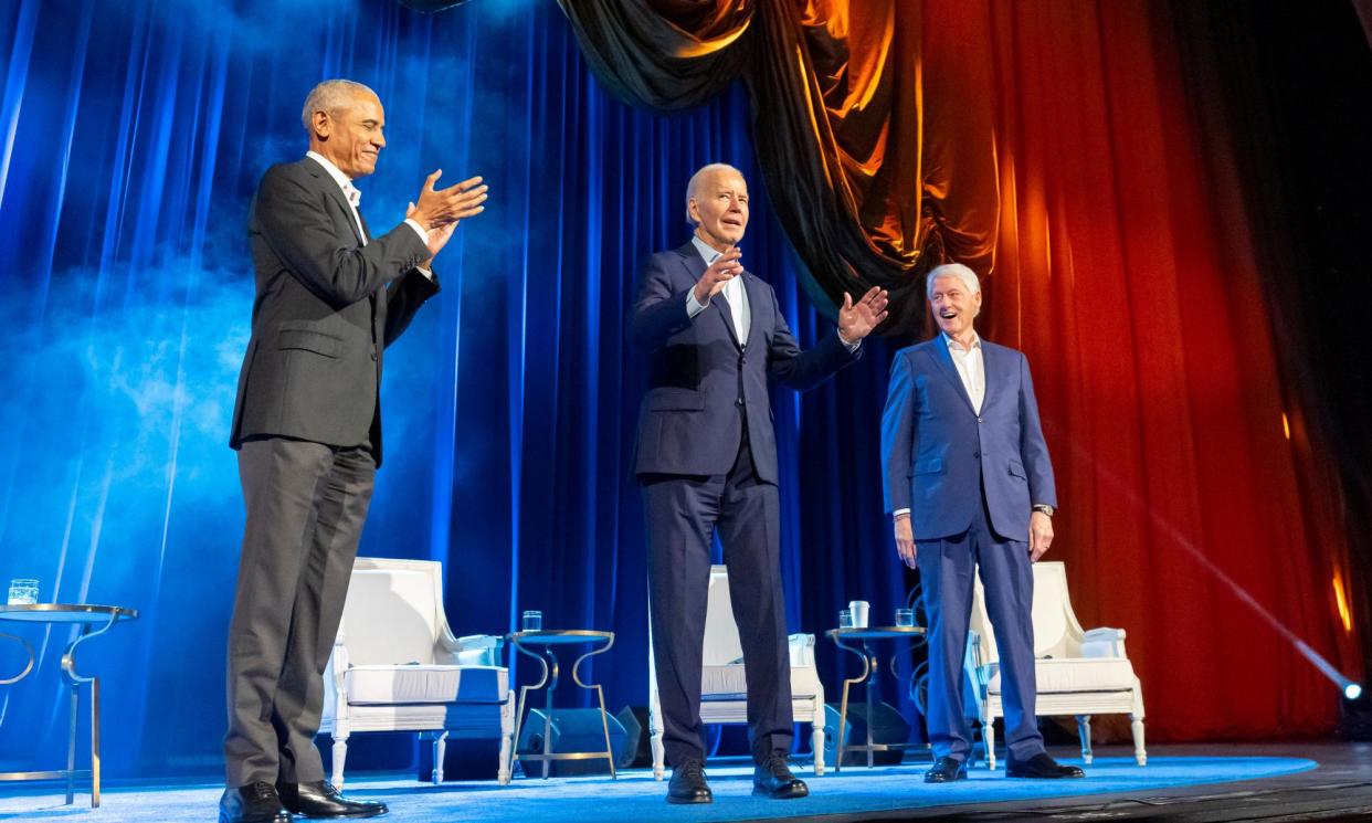 <span>Joe Biden, center, and former presidents Barack Obama and Bill Clinton participate in a fundraising event at Radio City Music Hall in New York on Thursday.</span><span>Photograph: Alex Brandon/AP</span>