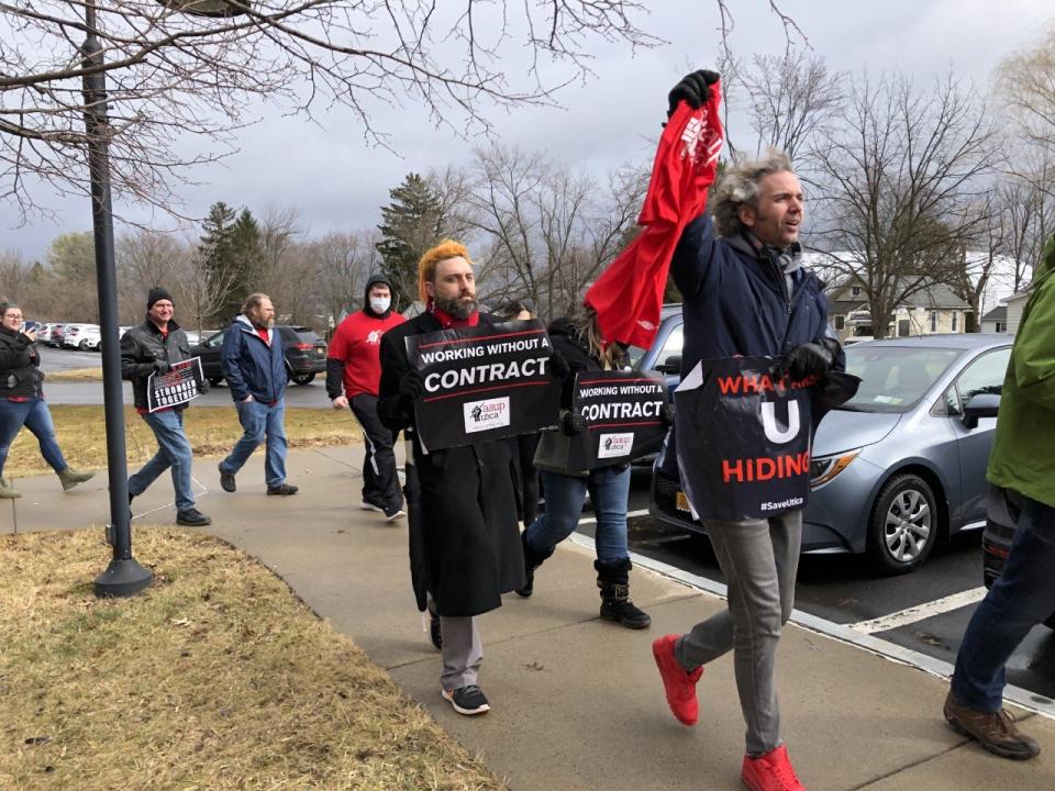 Douglas Edwards, associate professor of philosphy, front, and Dan Tagliarina, behind, take part in a protest on the Utica University campus on Friday, Feb. 17, 2023. Faculty, students and other community members have questioned a set of recommendations to eliminate and change a group of majors, and the process by which those recommendations were created.