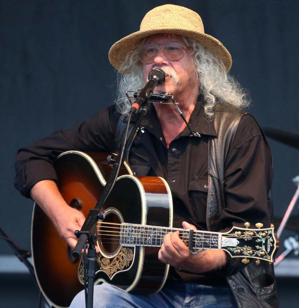 Arlo Guthrie performs at the 50th Anniversary of the Woodstock Festival at Bethel Woods Center for the Arts on August 15, 2019. The man behind "Alice's Restaurant" announced last year that his days performing have come to an end and he is "going fishing." He lives on a farm in the Berkshires, not far from where the events described in "Alice's Restaurant" took place.