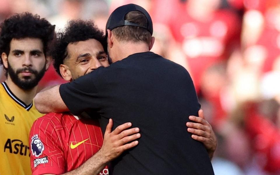 Jurgen Klopp hugs Mohamed Salah