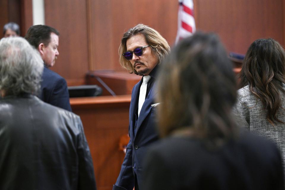 Actor Johnny Depp appears in the courtroom at the Fairfax County Circuit Court, April 12, 2022, in Fairfax, Va. A jury in Virginia is scheduled to hear opening statements in a defamation lawsuit filed by Johnny Depp against his ex-wife, Amber Heard. (Brendan Smialowski, Pool via AP)