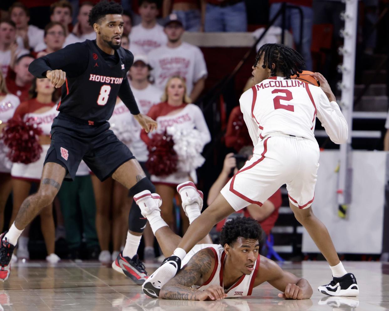 Oklahoma guard Javian McCollum (2) tries to maneuver against the tight defense of No. 1 Houston on Saturday, March 2. McCollumn will take a 13.6 points per game average into the Bearcats game.