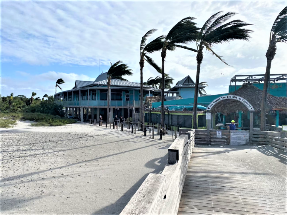 Sharky's on the Pier, pictured here after Hurricane Ian hit, is now open