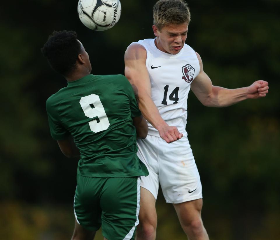 Spackenkill's Davis Barnes and O'Neill's Jay Waite go up for a header during Thursday's Section 9 Class B semifinal on October 26, 2023.