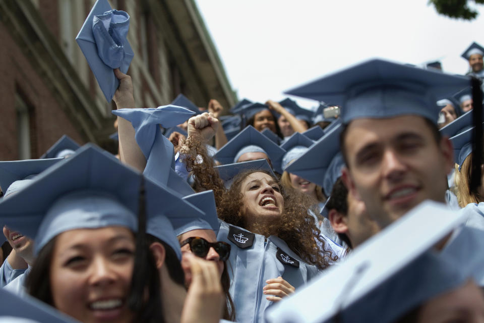 Graduates from Columbia University's School of Journalism cheer during the university's commencement ceremony in New York May 16, 2012. Over 12,000 students attended the annual graduation ceremony on the university's campus. REUTERS/Keith Bedford  (UNITED STATES - Tags: EDUCATION)