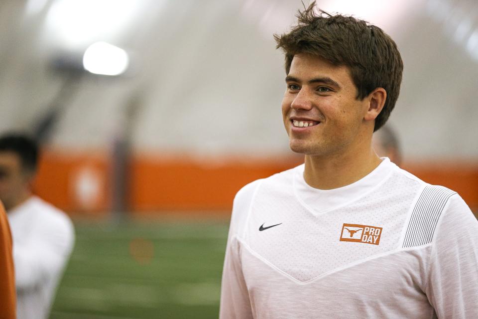 Former Texas kicker Cameron Dicker smiles while watching teammates work out at the annual Texas Pro day at the University of Texas at Austin on March 10, 2022.