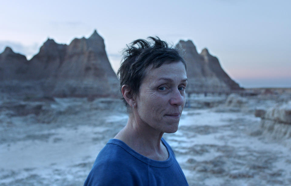 This image released by Searchlight Pictures shows Frances McDormand in a scene from the film "Nomadland." Chloe Zhao's film will premiere across the major fall film festivals in an alliance forged by the Venice, Toronto, New York and Telluride festivals. It's the first movie announced in the new partnership that has brought together the fall’s biggest movie launch pads, which typically compete against each other for world premiere rights. (Searchlight Pictures via AP)