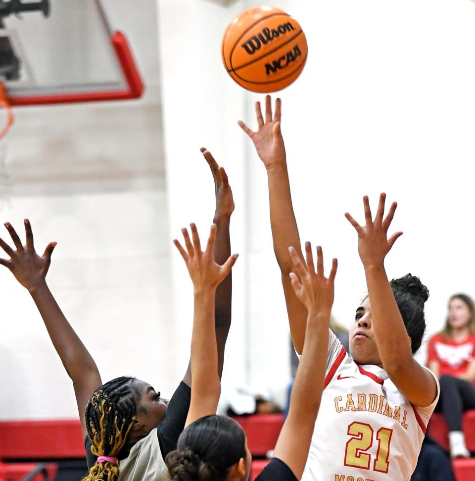 Cardinal Mooney's Kali Barrett (#21) scores two points over Tampa Catholic. Cardinal Mooney Catholic wins 64-40 victory over the visiting Tampa Catholic on Thursday evening, Feb.22, 2024, winning the Class 3A-Region 3 final at Patterson Pavilion.