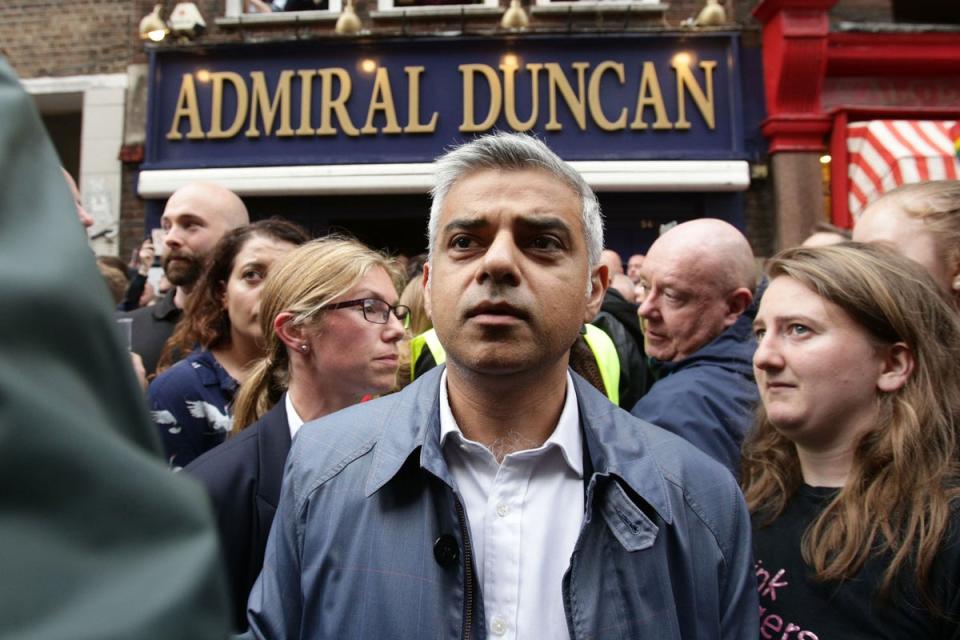 Shoulder to shoulder: Sadiq Khan joins crowds on Old Compton Street outside the Admiral Duncan pub (PA Wire)