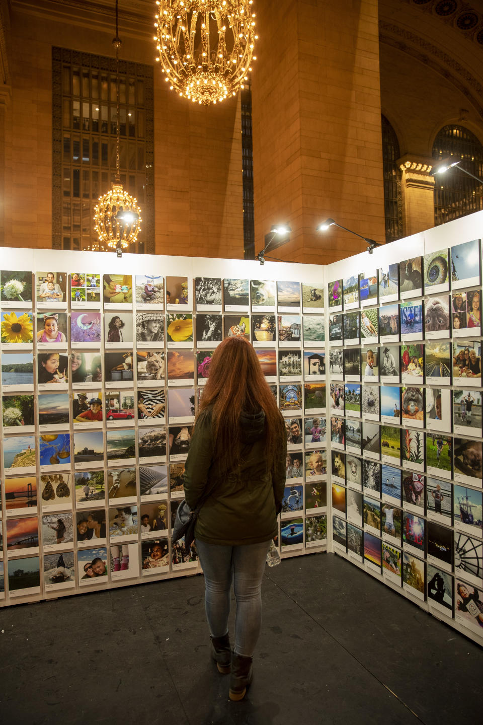 A visitor checks out photos selected for the second annual Fujifilm Printlife exhibit. (Photo: Gordon Donovan/Yahoo News)
