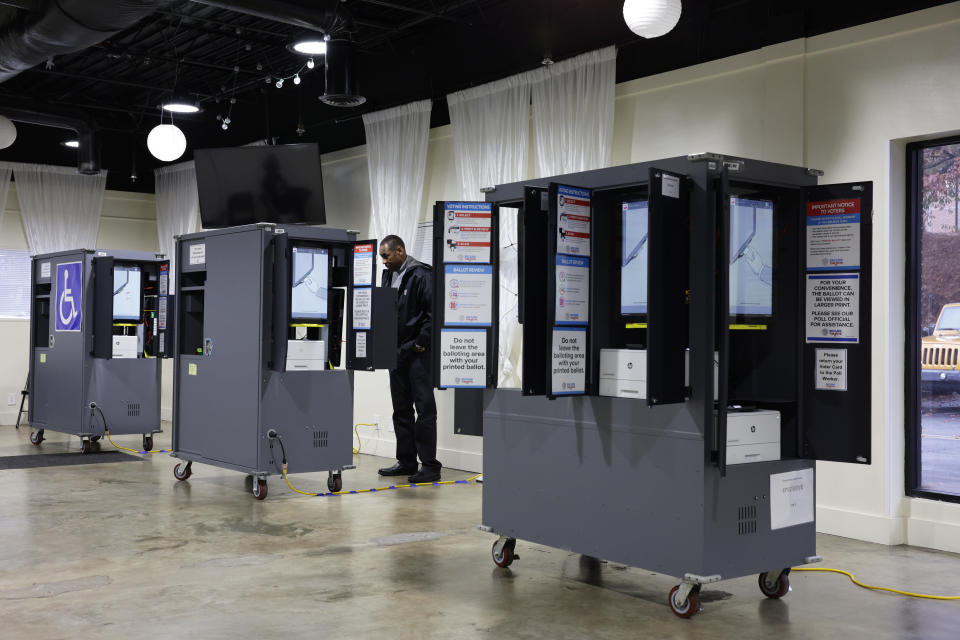 A voter casts his ballot at a polling station for the U.S. Senate runoff election on December 6, 2022 in Atlanta, Georgia.  / Credit: Alex Wong / Getty Images