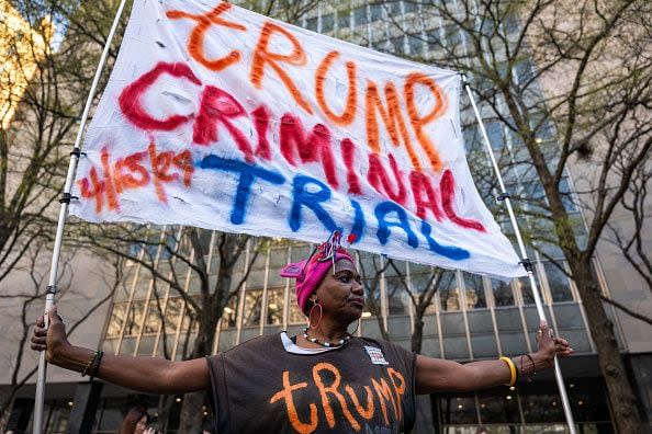 NEW YORK, NEW YORK - APRIL 15: Nadine Seiler protests against Donald Trump outside of a the Manhattan Criminal Courthouse at the start of first-ever criminal trial against a former president of the United States on April 15, 2024 in New York City. Former President Donald Trump faces 34 felony counts of falsifying business records in the first of his criminal cases to go to trial. (Photo by Spencer Platt/Getty Images)