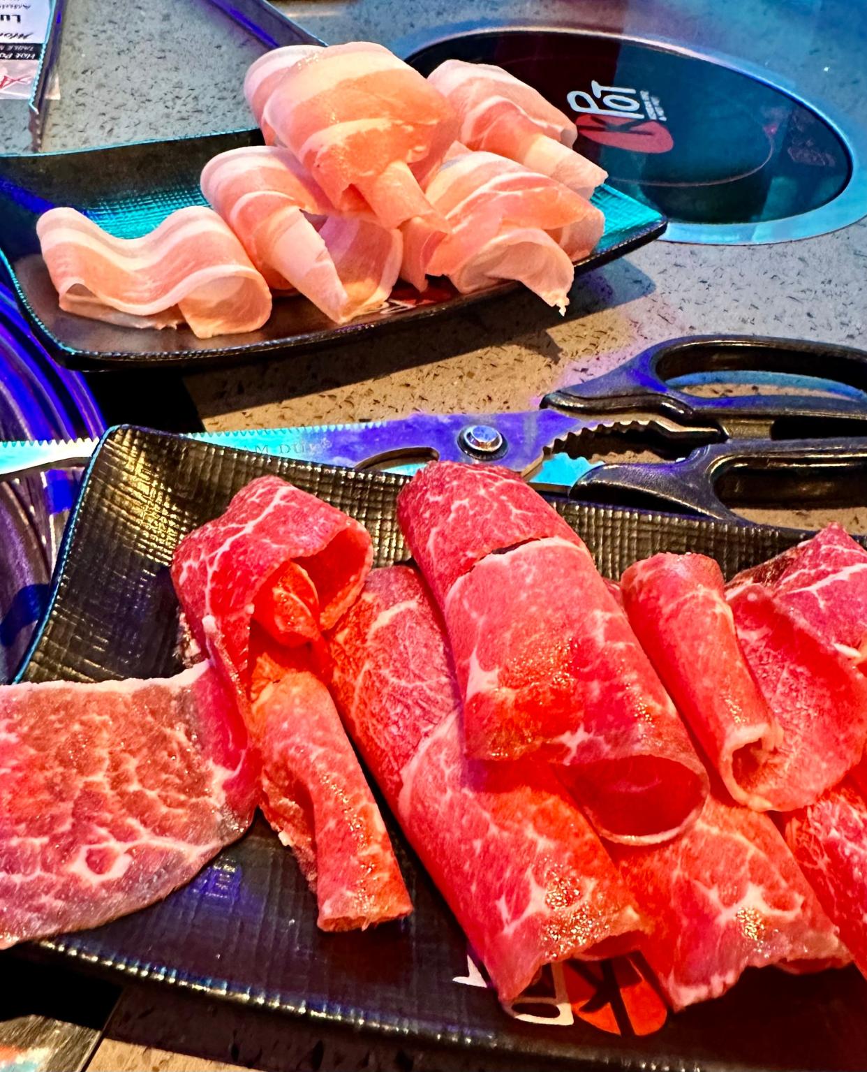 A selection of thinly sliced meats ready to be grilled at KPOT Korean BBQ & Hot Pot in Jackson Township.