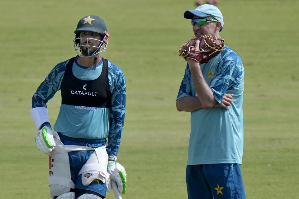 Pakistan's test team skipper Shah Masood, left, chats with test team's head coach Jason Gillespie during a practice session, in Multan, Pakistan, Saturday, Oct. 5, 2024. (AP Photo/Anjum Naveed)