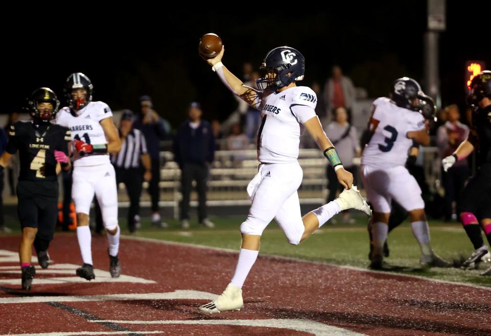 Corner Canyon’s Isaac Wilson scores a rushing touchdown as Corner Canyon and Lone Peak play at Lone Peak on Friday, Oct. 7, 2022. Corner Canyon won 35-6. | Scott G Winterton, Deseret News