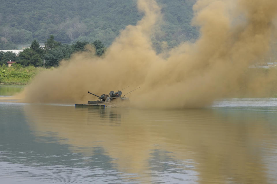 South Korea's K21 infantry fighting vehicle sails to shores in a smoke during the combined wet gap crossing military drill between South Korea and the United States as a part of the Ulchi Freedom Shield military exercise in Cheorwon, South Korea, Thursday, Aug. 31, 2023. (AP Photo/Lee Jin-man)