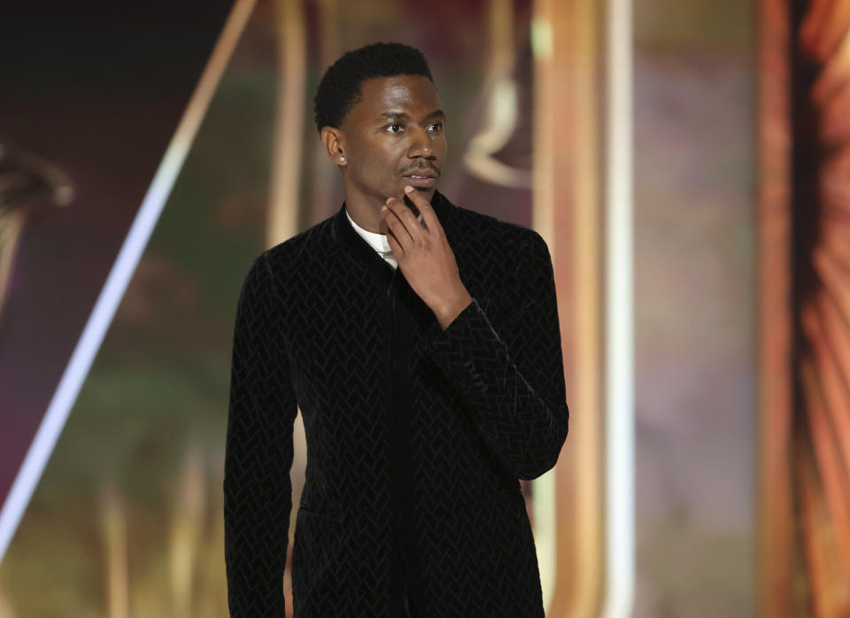 This image released by NBC shows host Jerrod Carmichael during his monologue at the 80th Annual Golden Globe Awards held at the Beverly Hilton Hotel on Tuesday, Jan. 10, 2023, in Beverly Hills, Calif. (Rich Polk/NBC via AP)