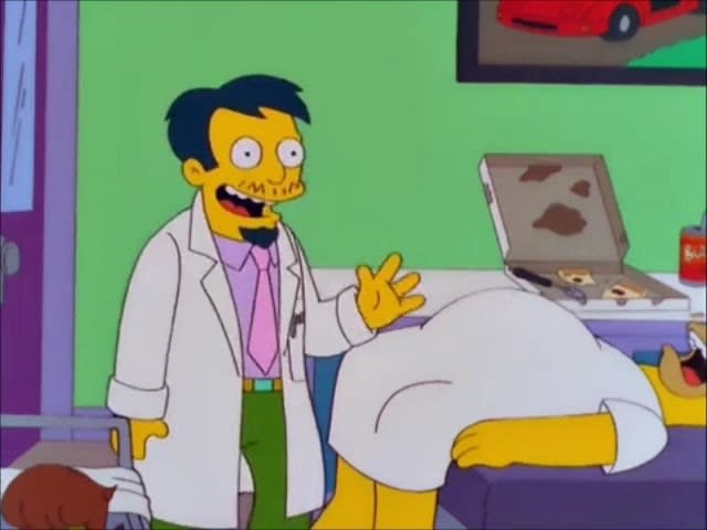 Doctor Nick smiles and waves from a medical room, where Homer is unconscious and there's a half-eaten pizza behind him