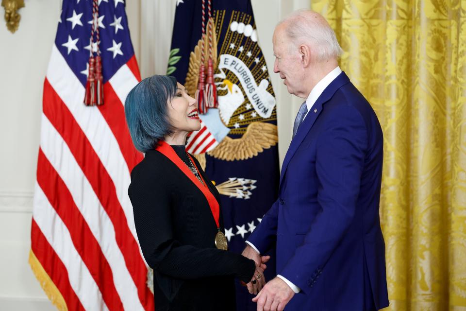 President Joe Biden awards author Amy Tan a National Humanities Medal during a ceremony in the East Room of the White House on March 21, 2023.