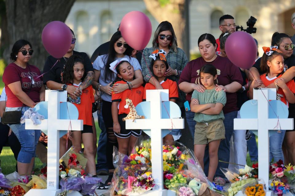 People visit memorials for victims of the Robb Elementary School shooting on May 26, 2022, in Uvalde, Texas. <a href="https://media.gettyimages.com/photos/people-visit-memorials-for-victims-of-tuesdays-mass-shooting-at-a-picture-id1399478668?s=2048x2048" rel="nofollow noopener" target="_blank" data-ylk="slk:Michael M. Santiago/Getty Images;elm:context_link;itc:0;sec:content-canvas" class="link ">Michael M. Santiago/Getty Images</a>