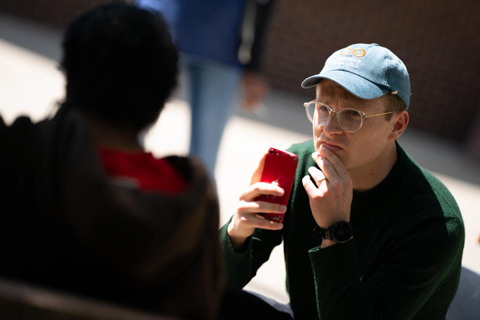 Community organizer Kevin Solomon takes a testimony video of a resident who went to the emergency room because of a bedbug infestation.(Sarah L. Voisin/The Washington Post)