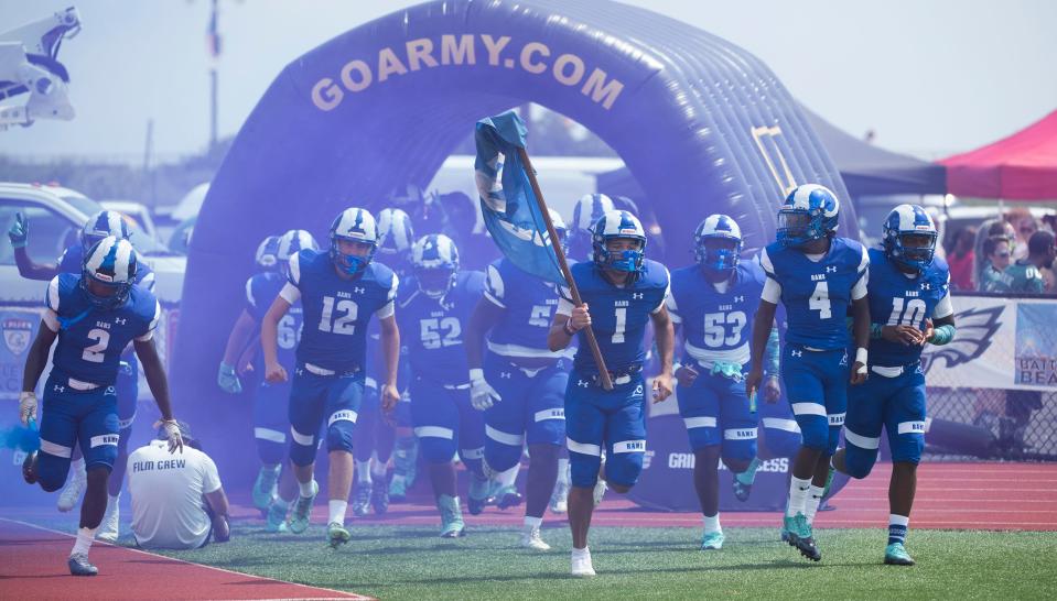 The Salem High School football team enters the field prior to the Battle at the Beach football game between Salem and Camden played in Ocean City on Friday, August 27, 2021.