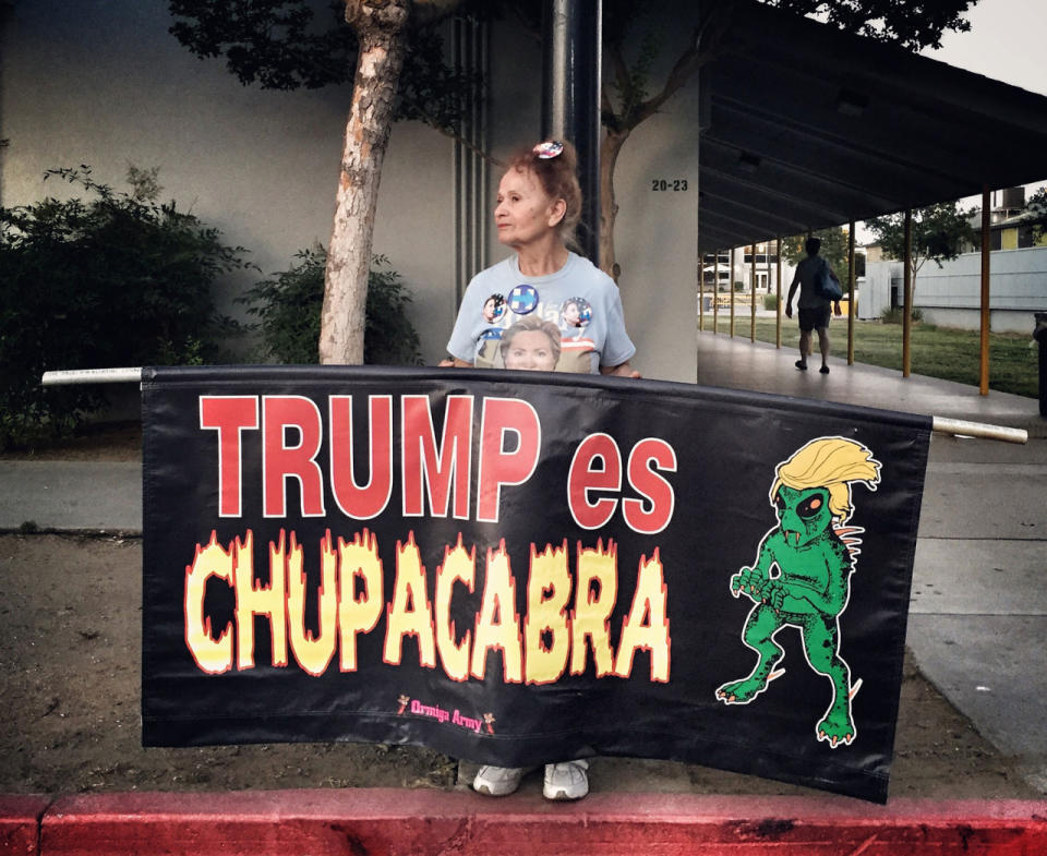 <p>A woman protests Donald Trump outside a Hillary Clinton rally, June 4, Fresno, Calif. (Photo: Holly Bailey/Yahoo News) </p>