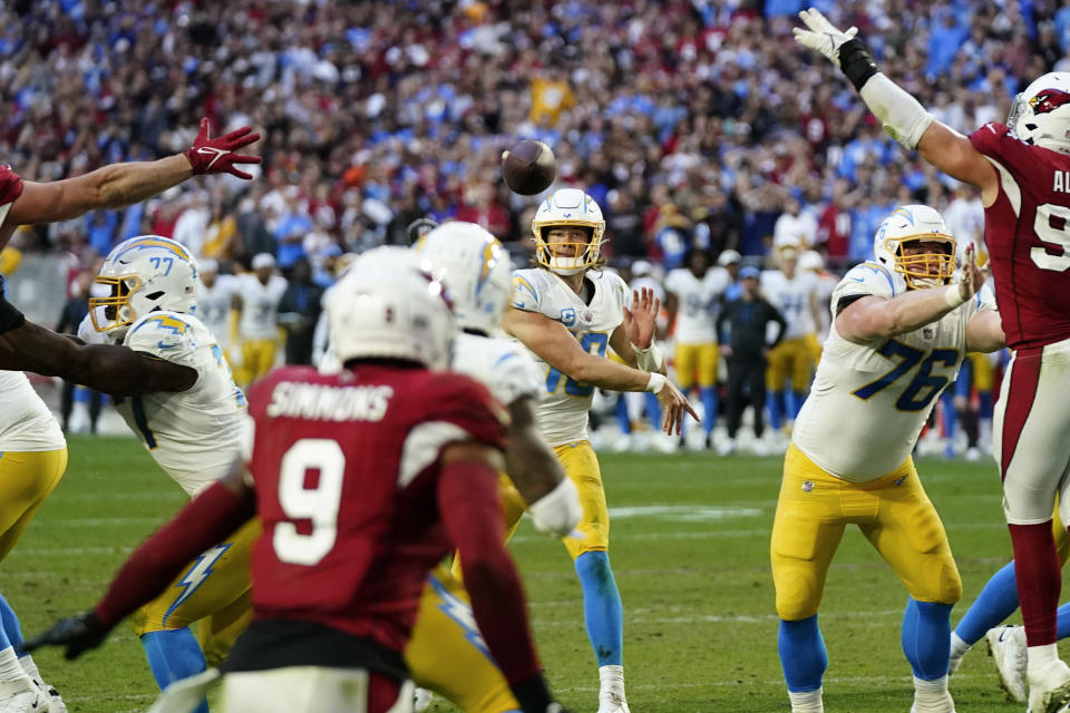 Los Angeles Chargers quarterback Justin Herbert throws for a two point conversion against the Arizona Cardinals during the second half of an NFL football game, Sunday, Nov. 27, 2022, in Glendale, Ariz. The Chargers defeated the Cardinals 25-24. (AP Photo/Ross D. Franklin)