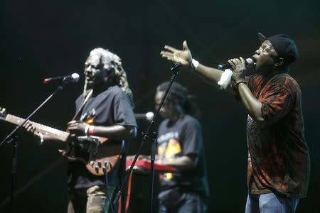 Ruben Koroma (R) with other members of Sierra Leone's Refugee All Stars perform during their concert in Gdynia, northern Poland July 25, 2014. REUTERS/Lukasz Glowala/Agencja Gazeta