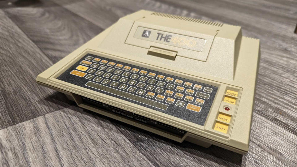 Atari 400 Mini review; a retro console on a grey wooden floor