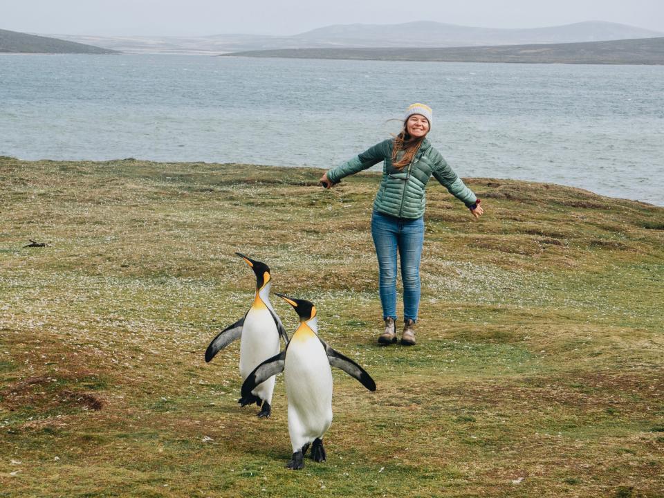 Nicole Jordan with penguins on the Falkland Islands