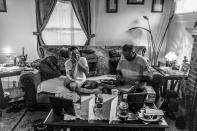 <p>Terri Fugate and her fiancé, Gene Robinson — is a a recovering heroin addict. An electrician, Gene prepares to head out for a job. (Photograph by Mary F. Calvert for Yahoo News) </p>