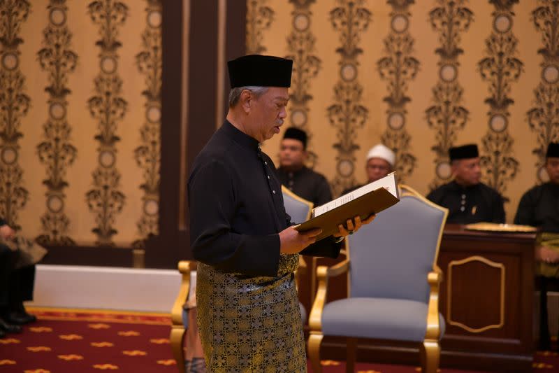 Muhyiddin Yassin takes oath during the swearing-in ceremony as the 8th prime minister of Malaysia in Kuala Lumpur