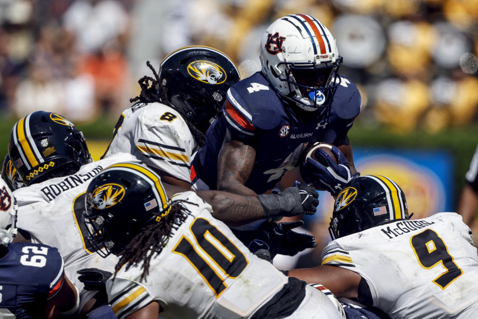 Missouri linebacker Ty'Ron Hopper (8) stops Auburn running back Tank Bigsby (4) on fourth down during the second half of an NCAA college football game, Saturday, Sept. 24, 2022 in Auburn, Ala. (AP Photo/Butch Dill)