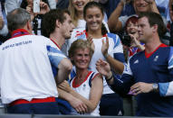 Britain's Andy Murray (2nd from L) greets friends and family, including his mother Judy (C), after defeating Switzerland's Roger Federer in the men's singles tennis gold medal match at the All England Lawn Tennis Club during the London 2012 Olympic Games August 5, 2012. REUTERS/Stefan Wermuth (BRITAIN - Tags: OLYMPICS SPORT TENNIS) 