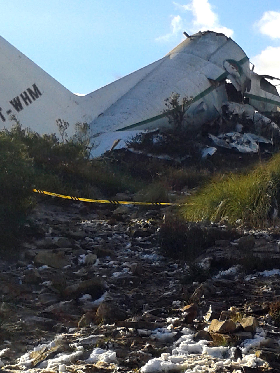 An Algerian military transport plane is pictured after it slammed into a mountain in the country’s rugged eastern region, Tuesday, Feb. 11, 2014. A civil defense official said 102 people on board were killed but one person managed to survive. The U.S.-built C-130 Hercules transport crashed about noon near the town of Ain Kercha, 50 kilometers (30 miles) southeast of Constantine, the main city in eastern Algeria. ( AP Photo/ Mohamed Ali)