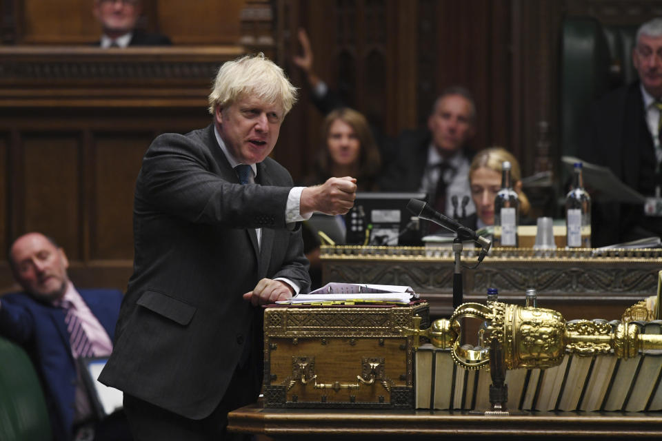 In this handout photo provided by UK Parliament, Britain's Prime Minister Boris Johnson speaks during Prime Minister's Questions in the House of Commons in London, Wednesday, Sept. 16, 2020. U.K. lawmakers have criticized the government’s handling of the COVID-19 testing crisis for a second day as opposition leaders say Prime Minister Boris Johnson lacked a cohesive plan to tackle the virus as the country faces a second wave in the pandemic. (Jessica Taylor/UK Parliament via AP)