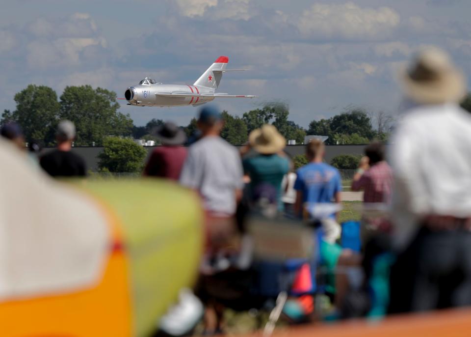 A MiG-17 Fresco makes a low pass in front of the crowd during Day 4 of EAA AirVenture on Thursday, July 28, 2022, at Wittman Regional Airport in Oshkosh, Wis. Tork Mason/USA TODAY NETWORK-Wisconsin 